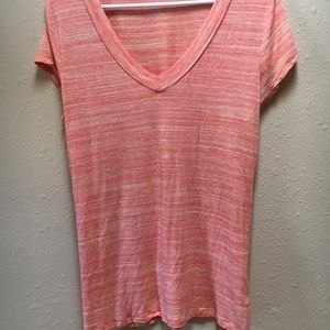Orange and white striped stretchy tee.